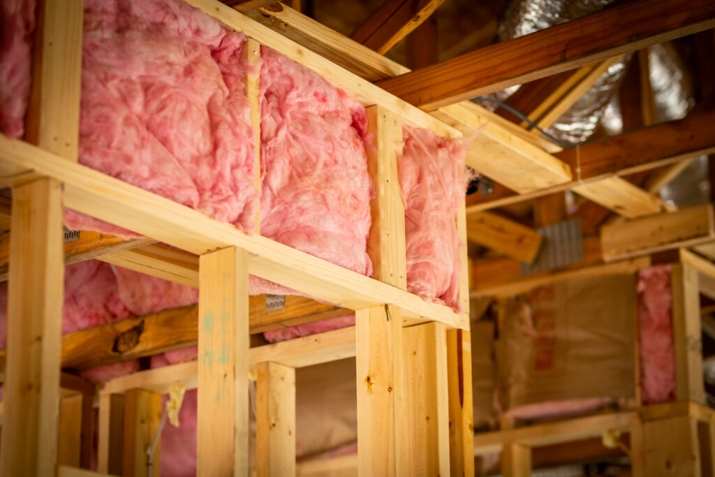 Pink Fiberglass insulation in a wall